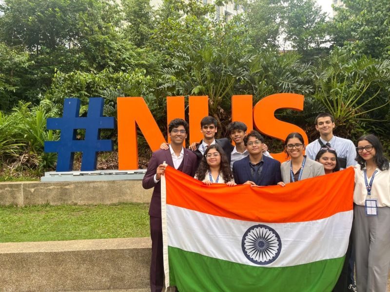 The delegation with the Indian flag at the NUS campus